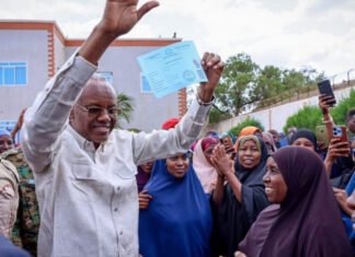 South West State President Leads Voter Registration Drive, Becomes First to Receive Card